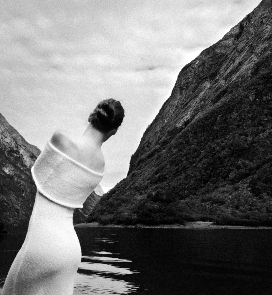 creative portrait of a woman facing fjord