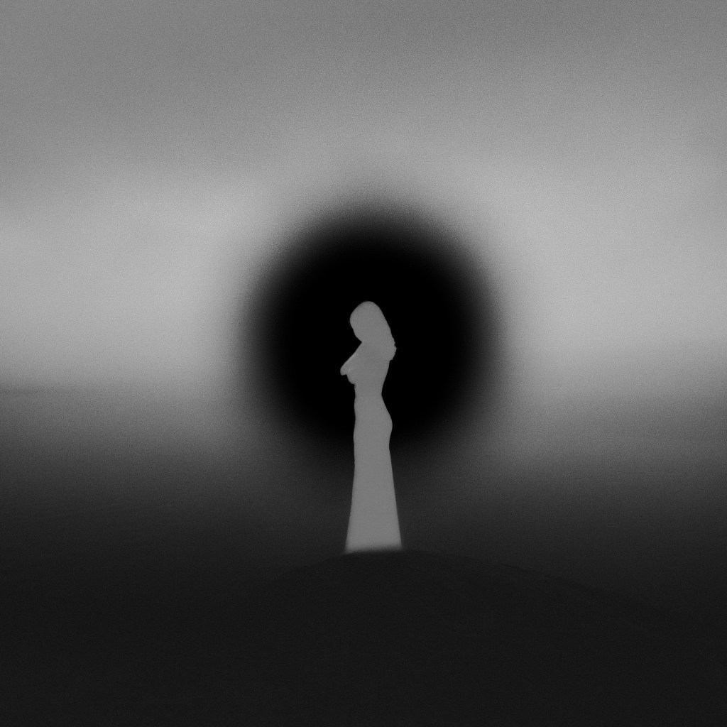 Silhouette of a woman against dark circular background